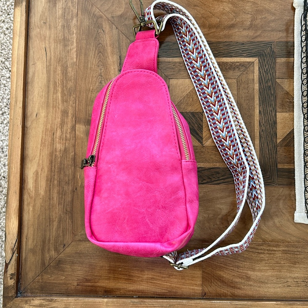 Pink crossbody bag with adjustable guitar strap